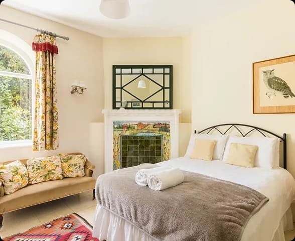 A stylish bedroom prepared for guests at Upper Court