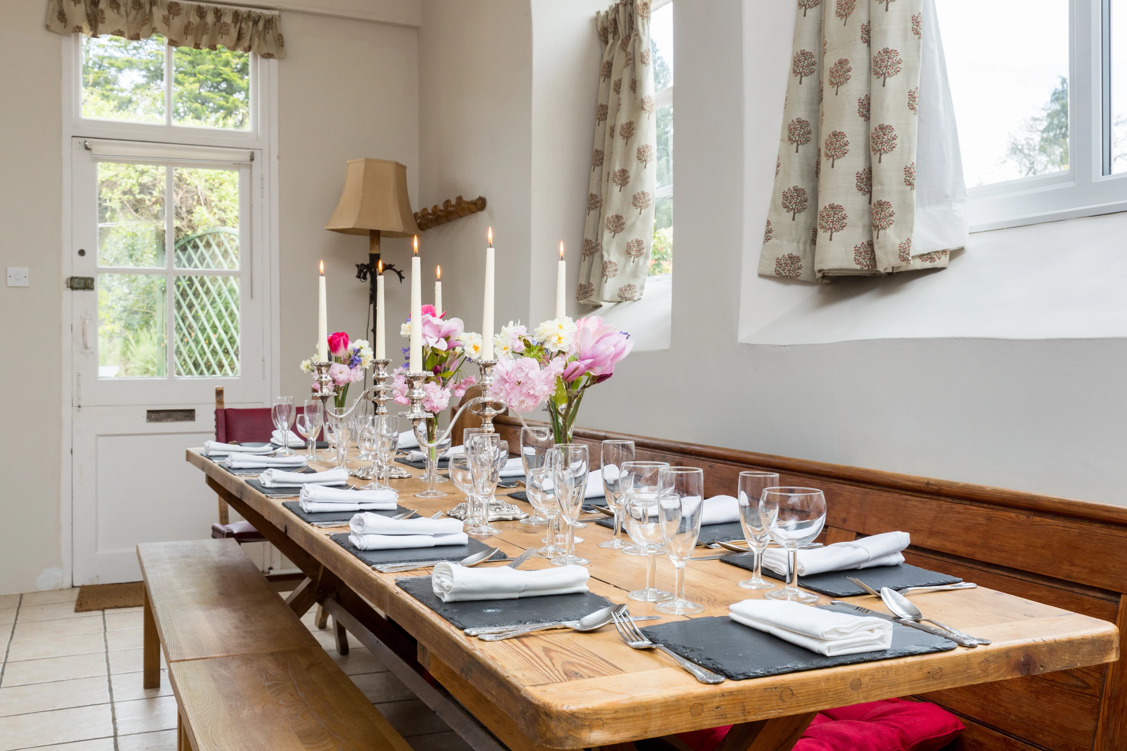The Coach House dining table set for guests