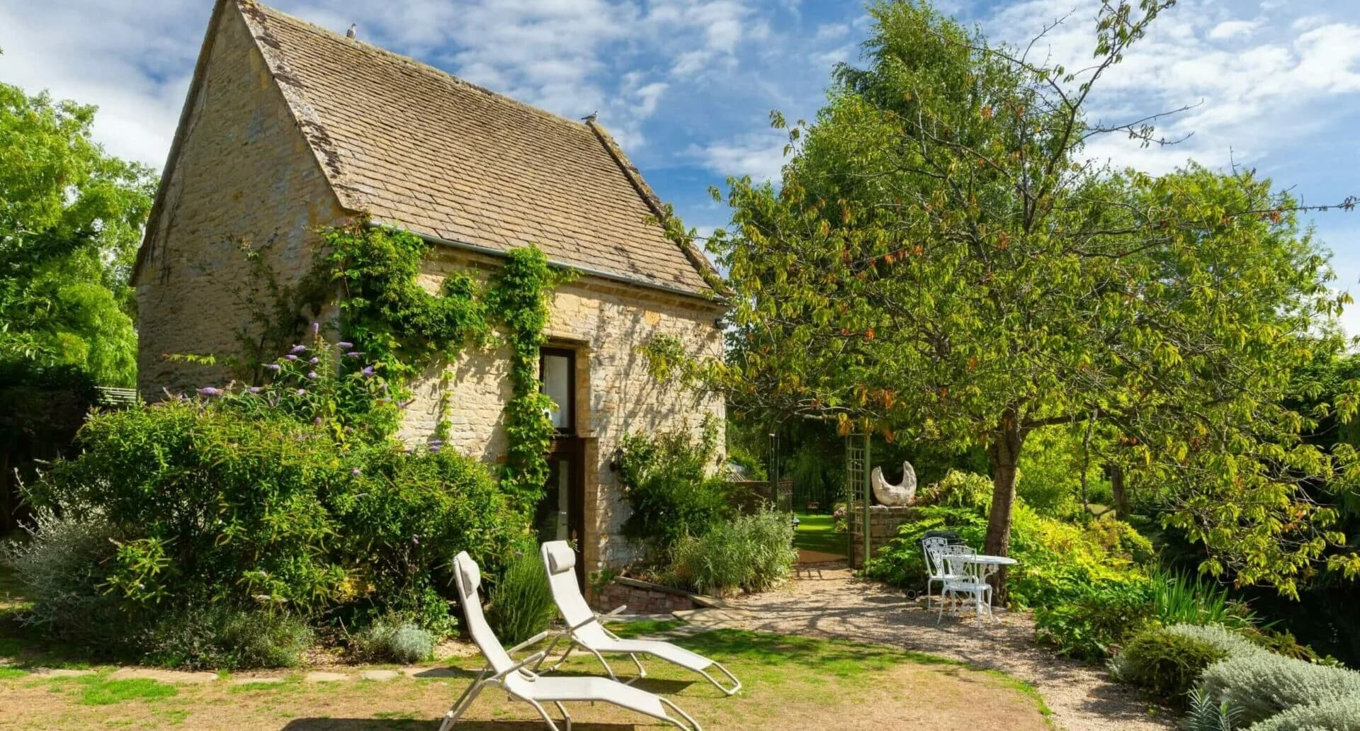 The Dovecote cottage exterior beside the garden