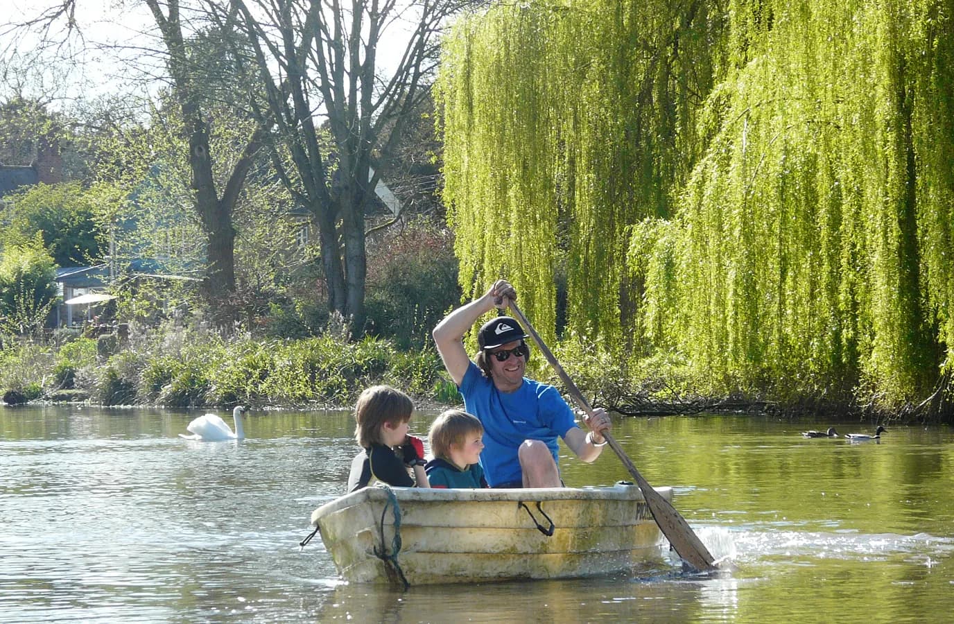 Family boating on the lake at Upper Court